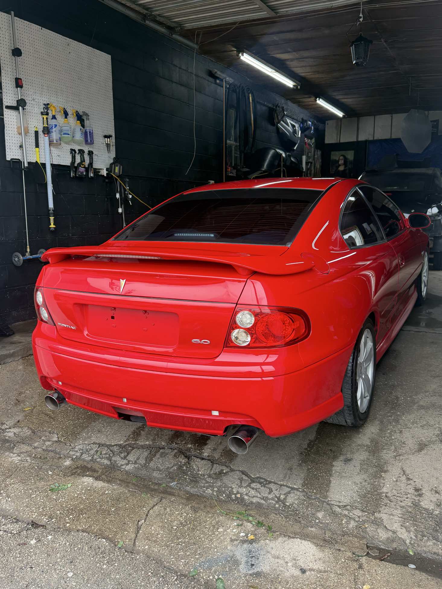Red Pontiac GTO 6.0 rear view after detailing
